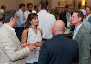 People networking at the sustainability conference.