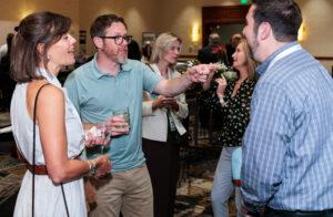 People networking at the sustainability conference.